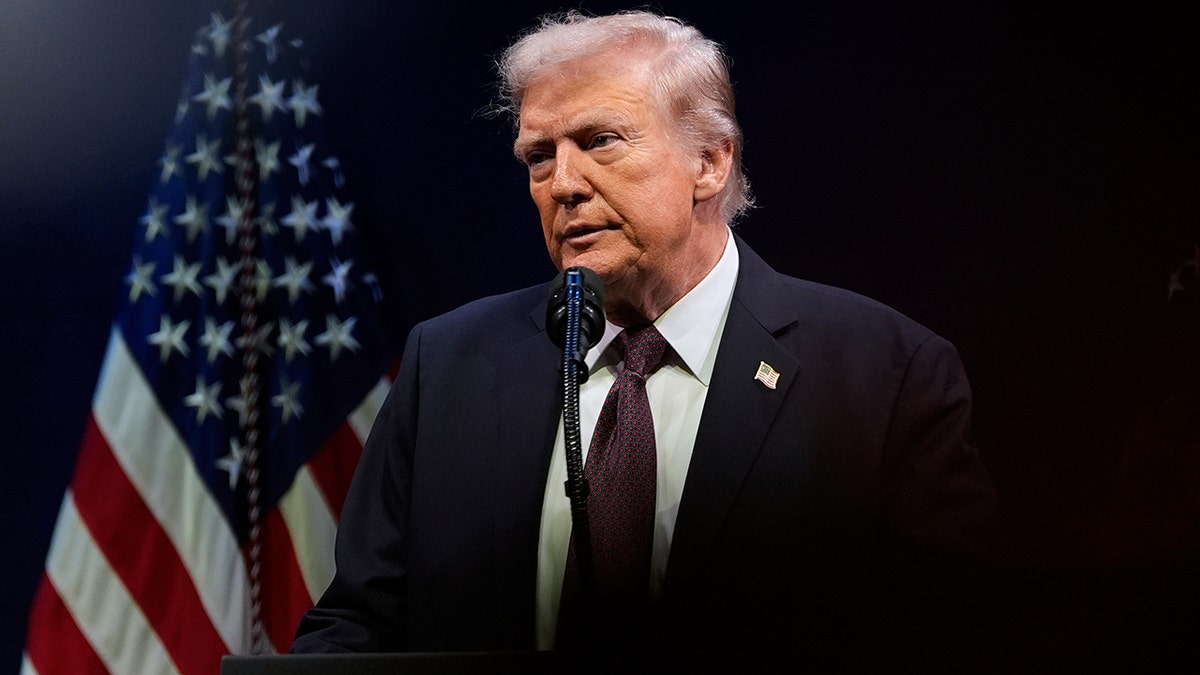 President Donald Trump speak in front of American flag