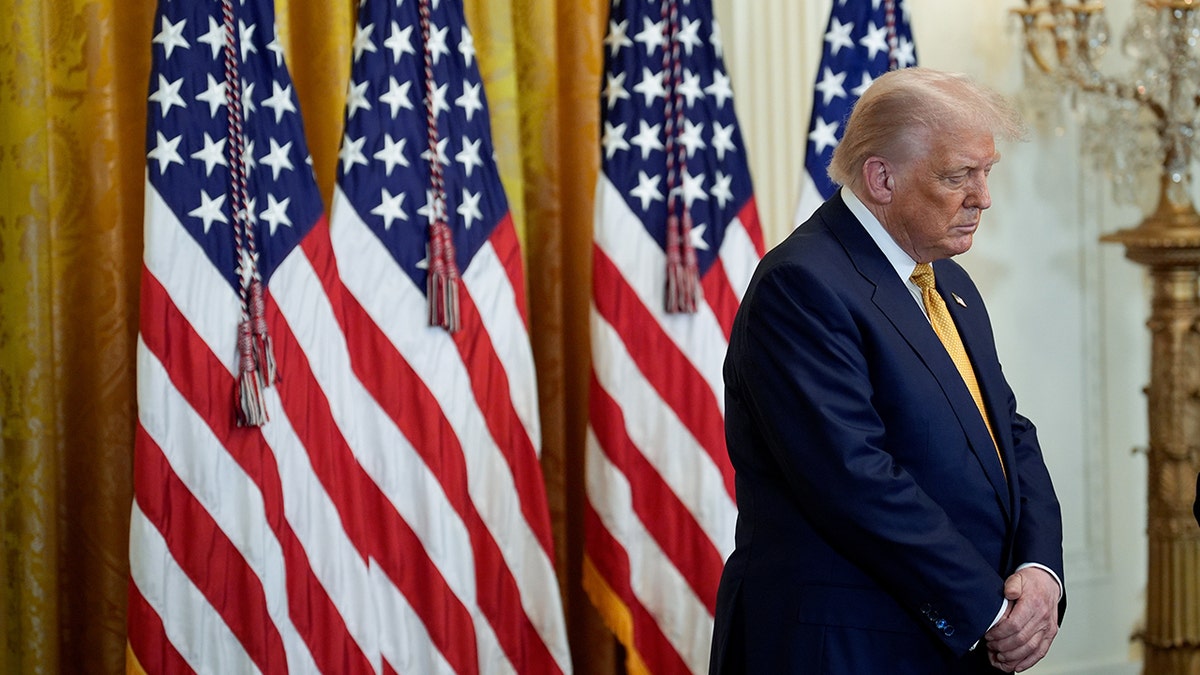 President Trump bows head in prayer