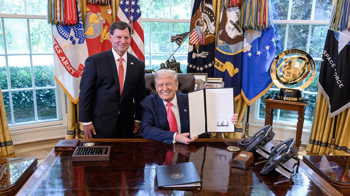 Donald Trump and SSA Commissioner Frank Bisignano in Oval Office with signed proclamation
