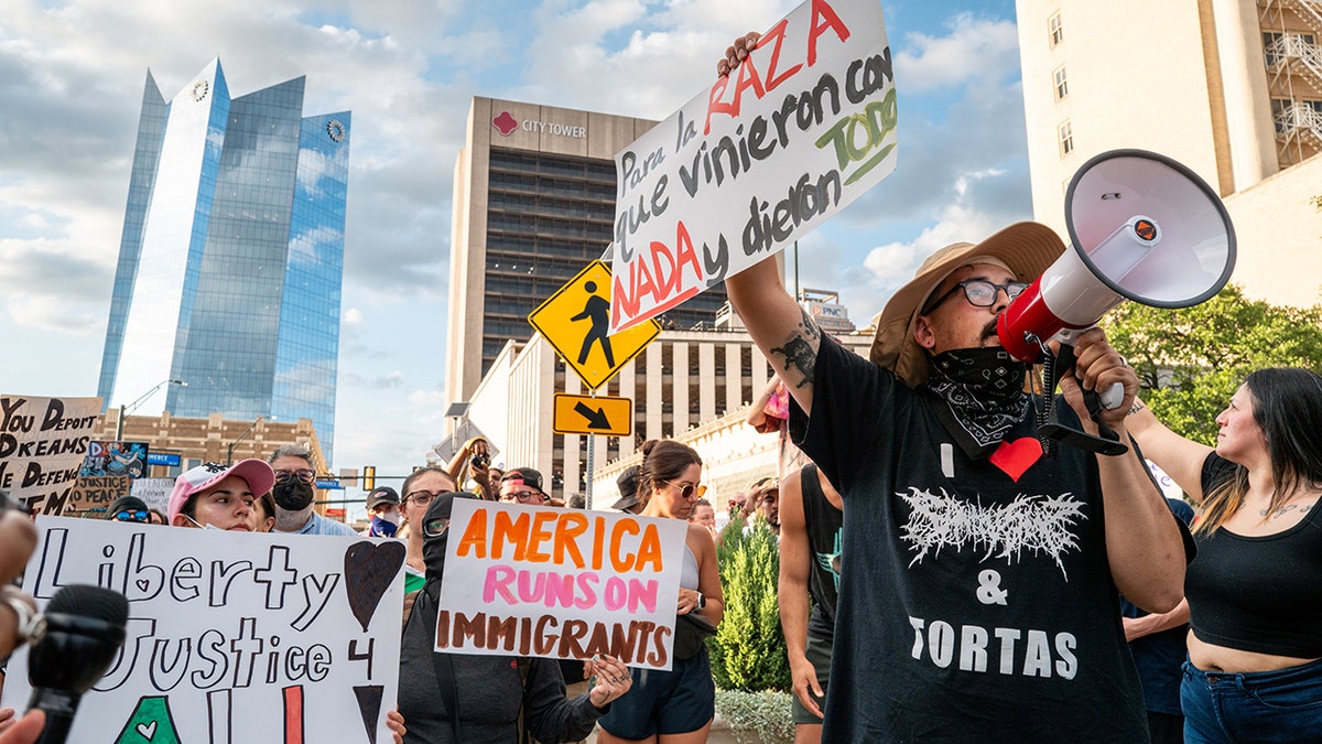 Protesters hold signs and shout in San Antonio, Texas