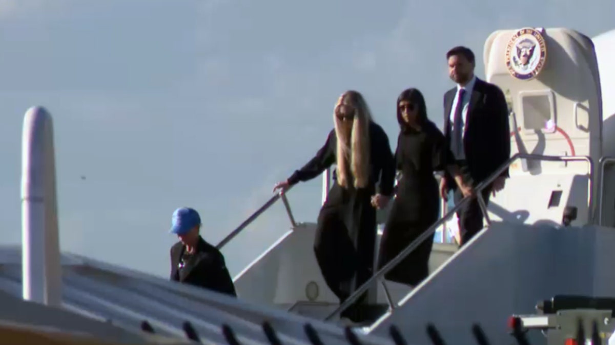 Vances deboard Air Force Two with Erika Kirk