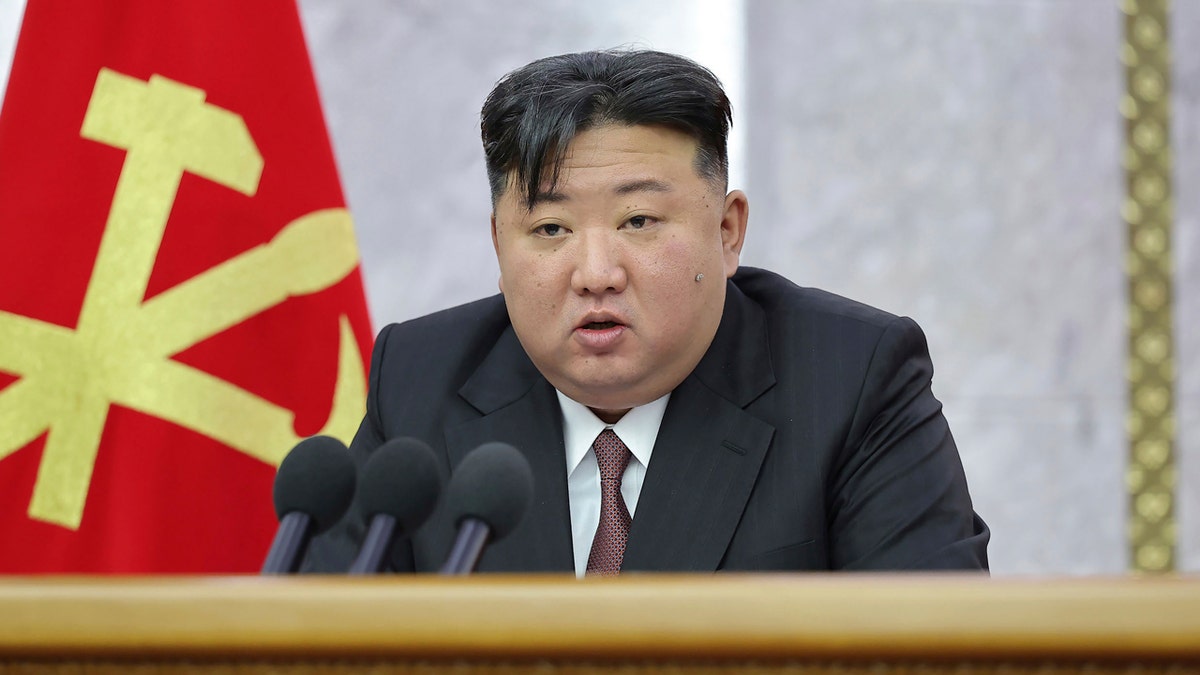 North Korean leader Kim Jong Un delivers a speech during a meeting of Central Committee of the Workers' Party of Korea 