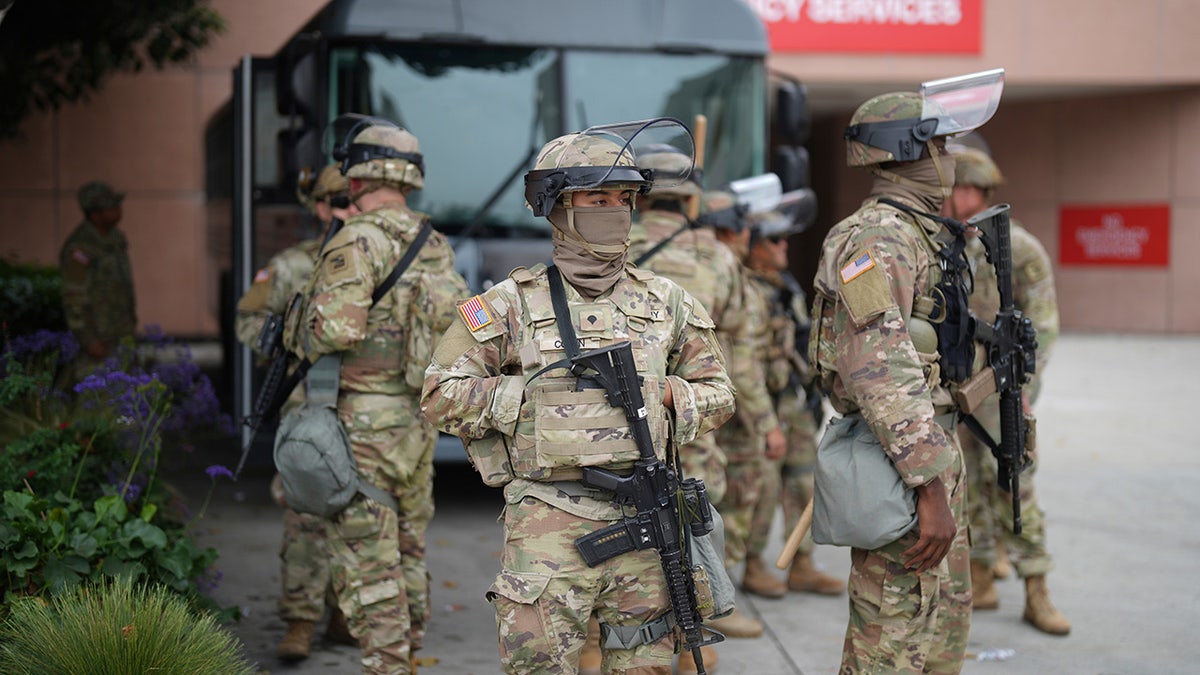 U.S. National Guard walking by vehicle