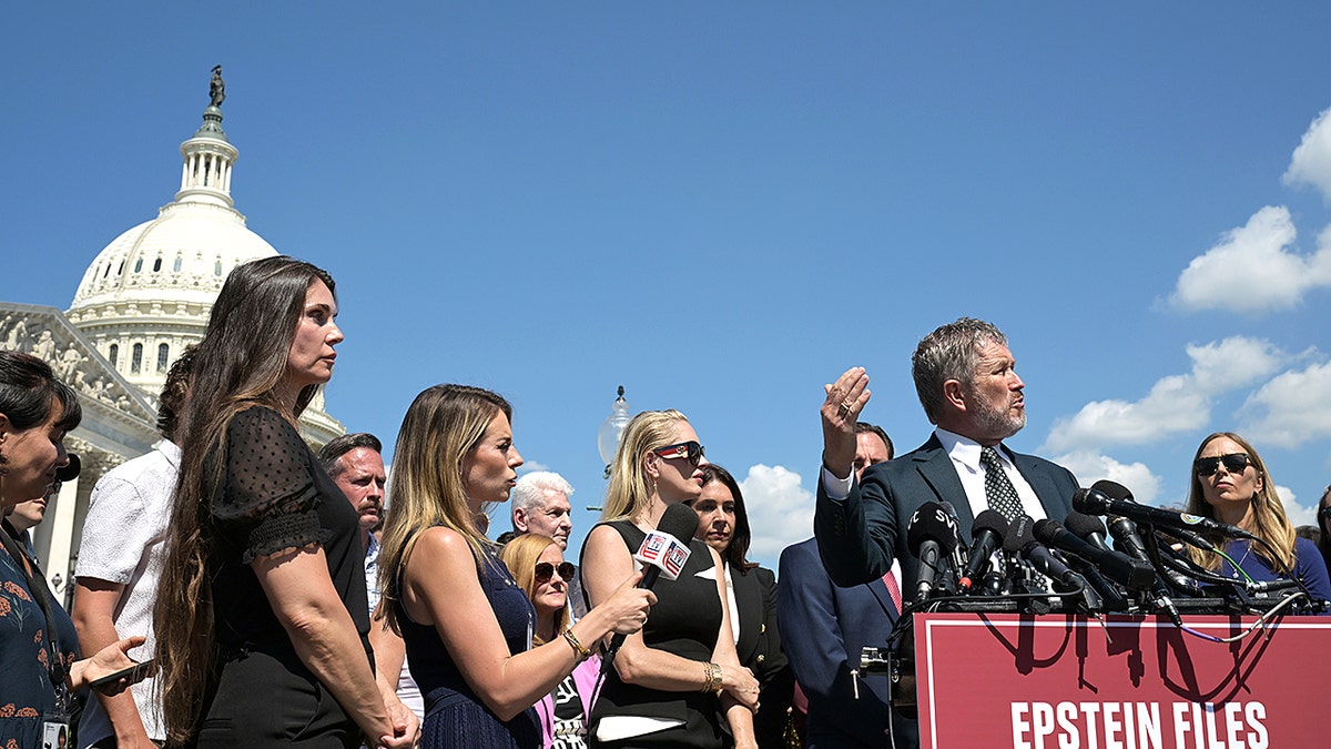 Thomas Massie and Epstein accusers in front of the U.S. Capitol building