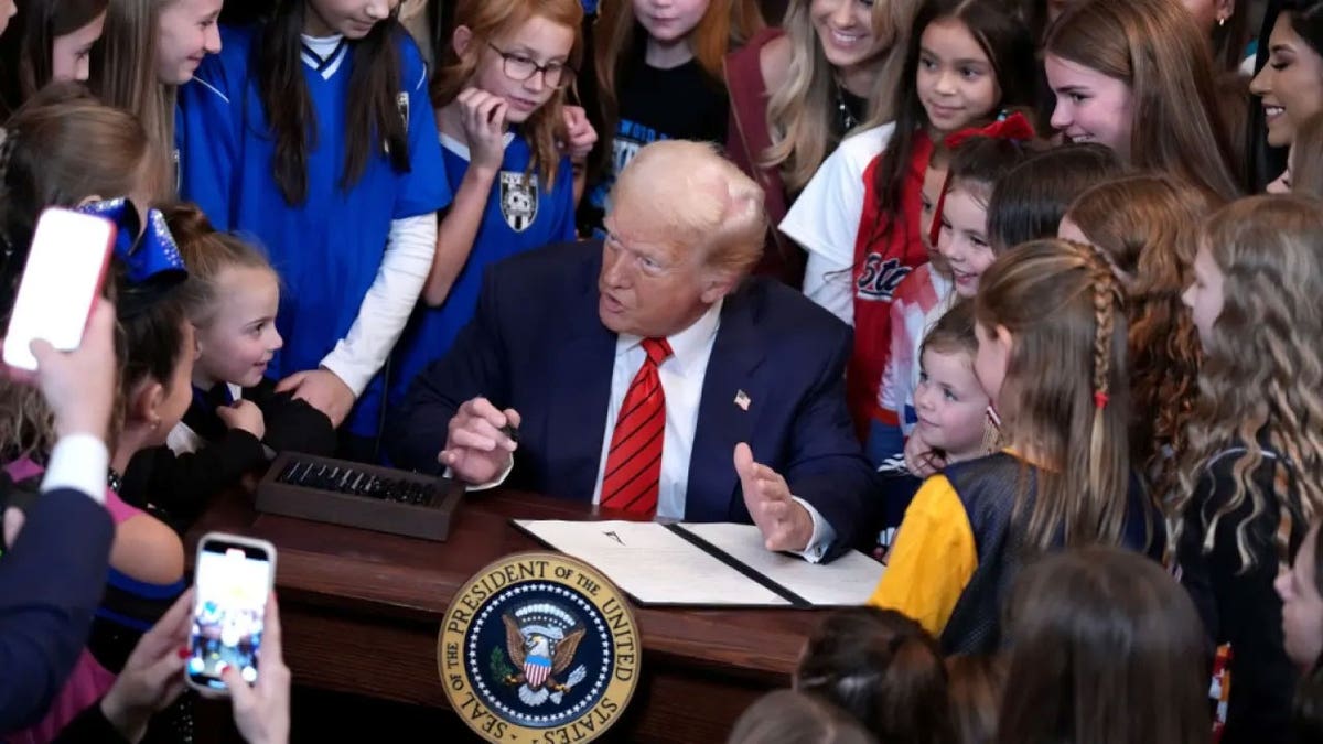 trump signs transgender sports act in front of youngsters