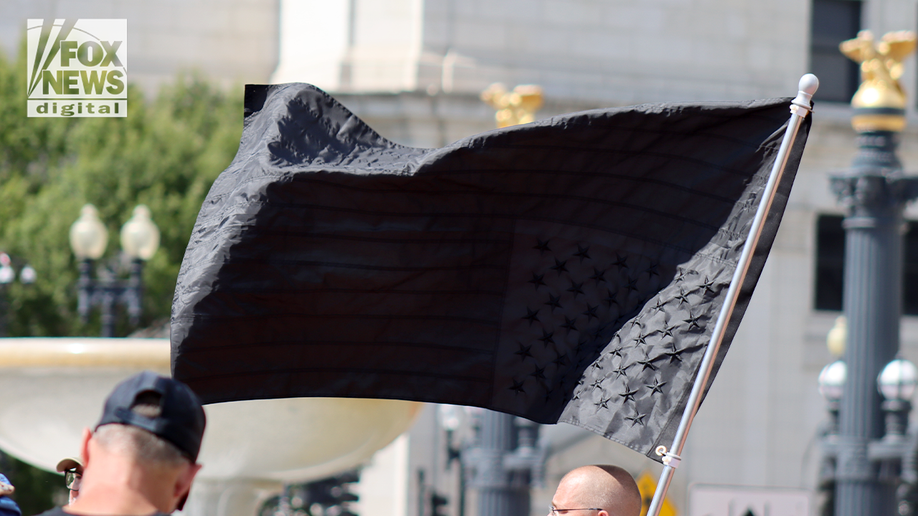 upside down black american flag