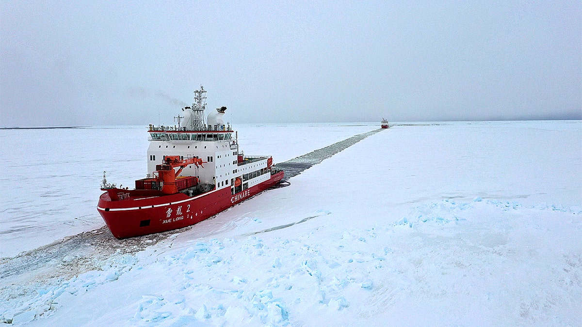 Aerial view of China’s research icebreakers Xuelong and Xuelong 2 breaking through sea ice near Zhongshan Station in Antarctica
