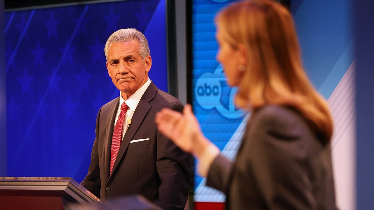 Republican Jack Ciattarelli looks at Democrat Mikie Sherrill during debate