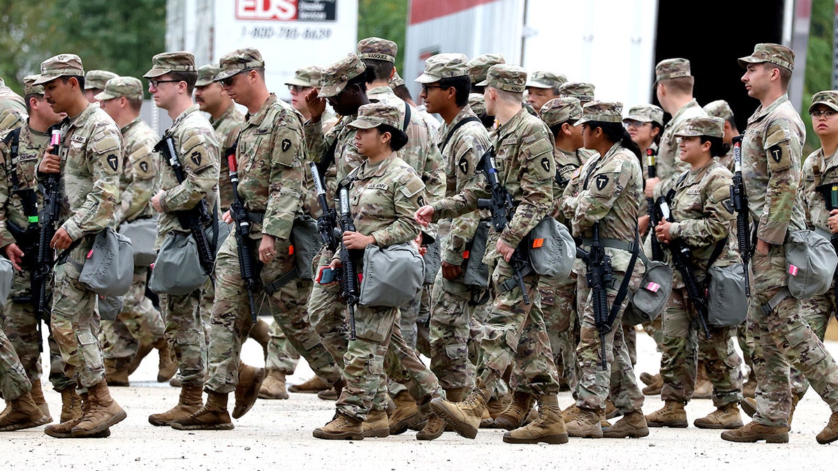 Members of the Texas National Guard gather at the Army Reserve Training Center in Elwood, Illinois.