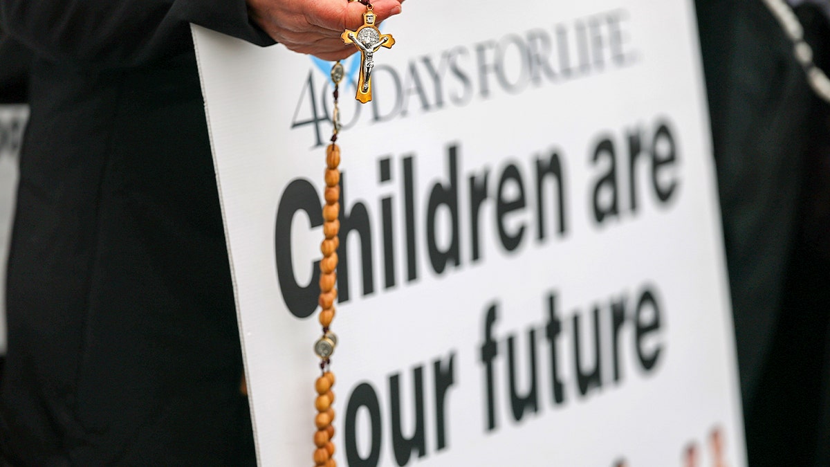 A 40 Days for Life sign reads "Children are our future"