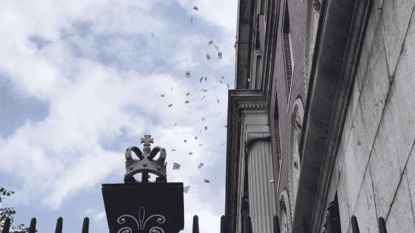 Flyers promoting an October 7 pro-Palestine rally fly from the windows of building inside Columbia University.