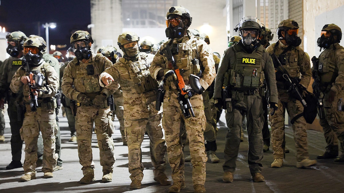 Federal agents outside ICE facility in Portland, Oregon.