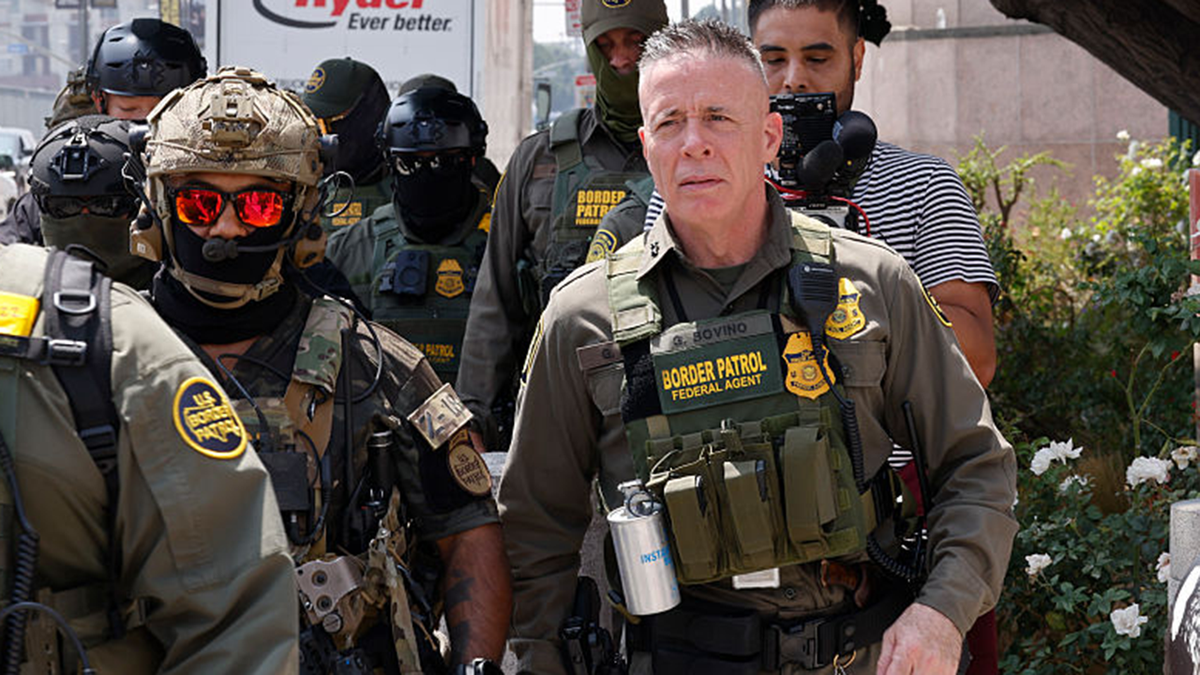 Gregory Bovino stands with ICE officers in Los Angeles
