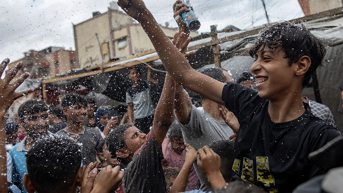 Palestinians celebrate in Gaza at the announcement of a ceasefire agreement