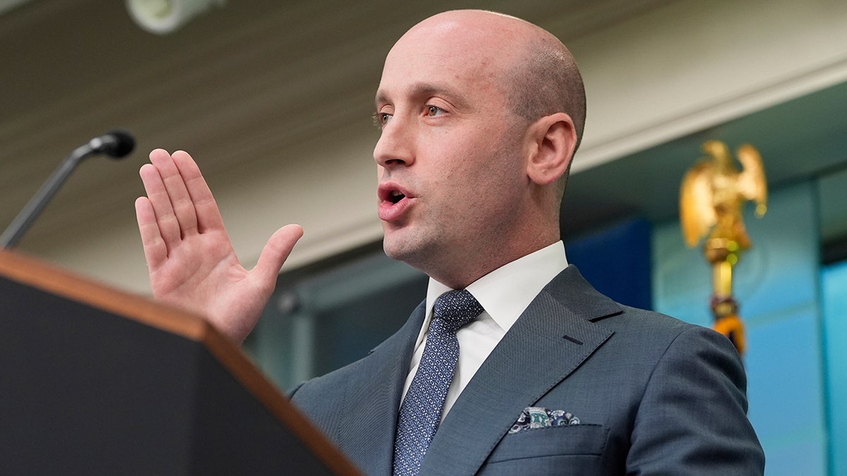 Stephen Miller gesturing at the podium