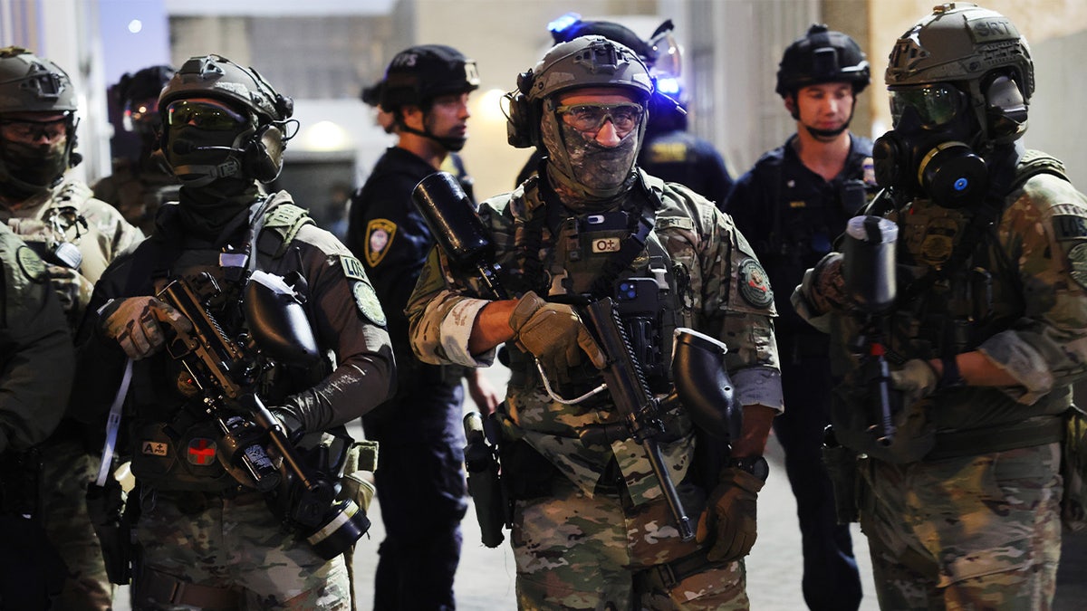 Federal agents outside an ICE facility in Portland, Oregon