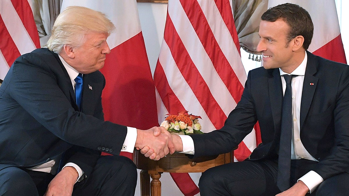 President Donald Trump shakes hands with French President Emmanuel Macron