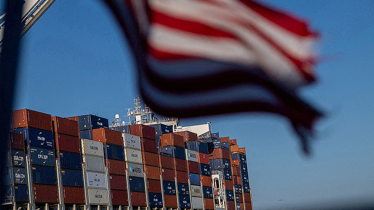 A cargo ship full of shipping containers is seen at the port of Oakland, California.