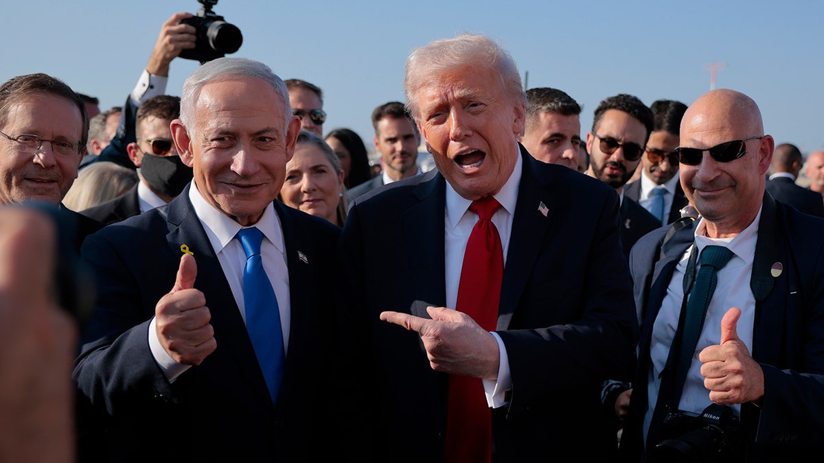 President Donald Trump speaks to Israeli Prime Minister Benjamin Netanyahu at Ben Gurion International Airport before boarding his plane to Sharm El-Sheikh.