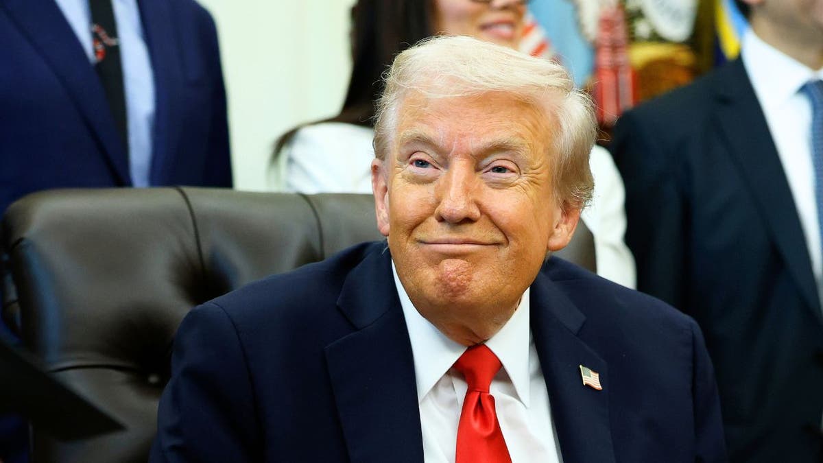 President Donald Trump listens during a meeting in the Oval Office