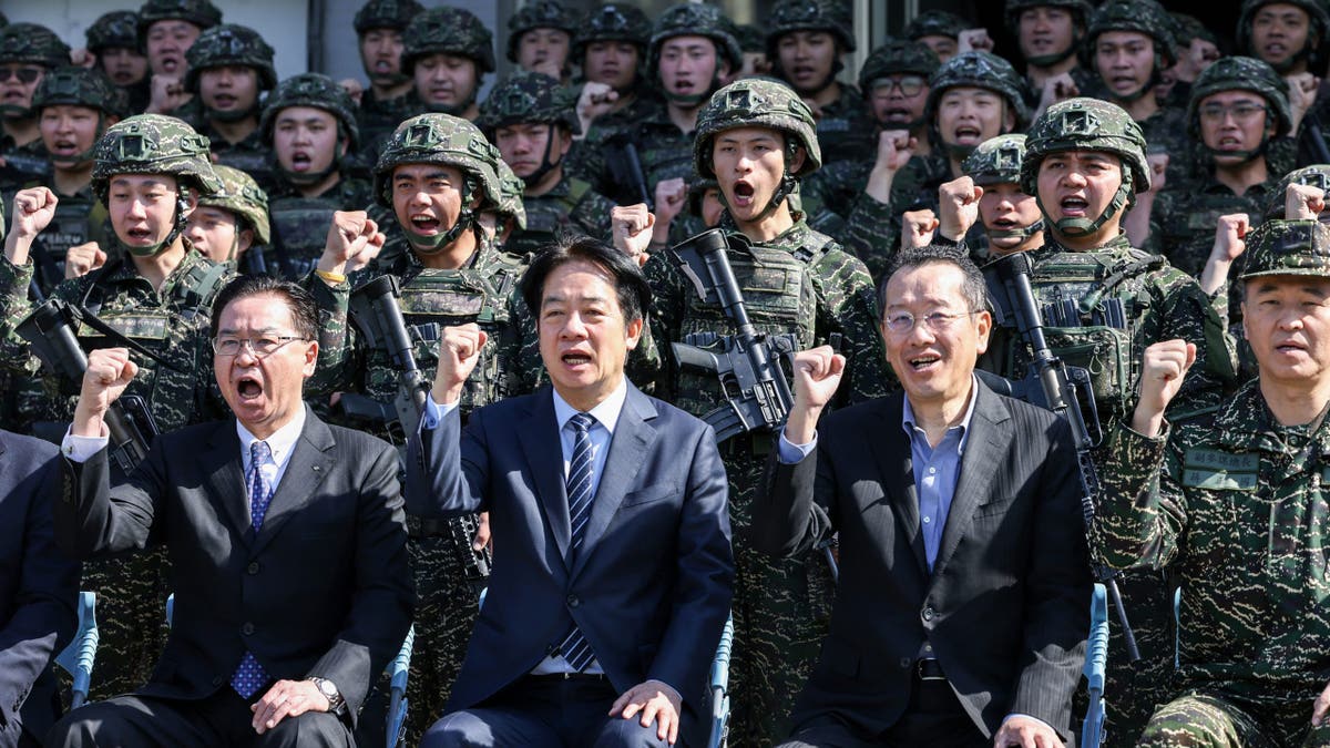 Taiwan national security advisor cheers along with military