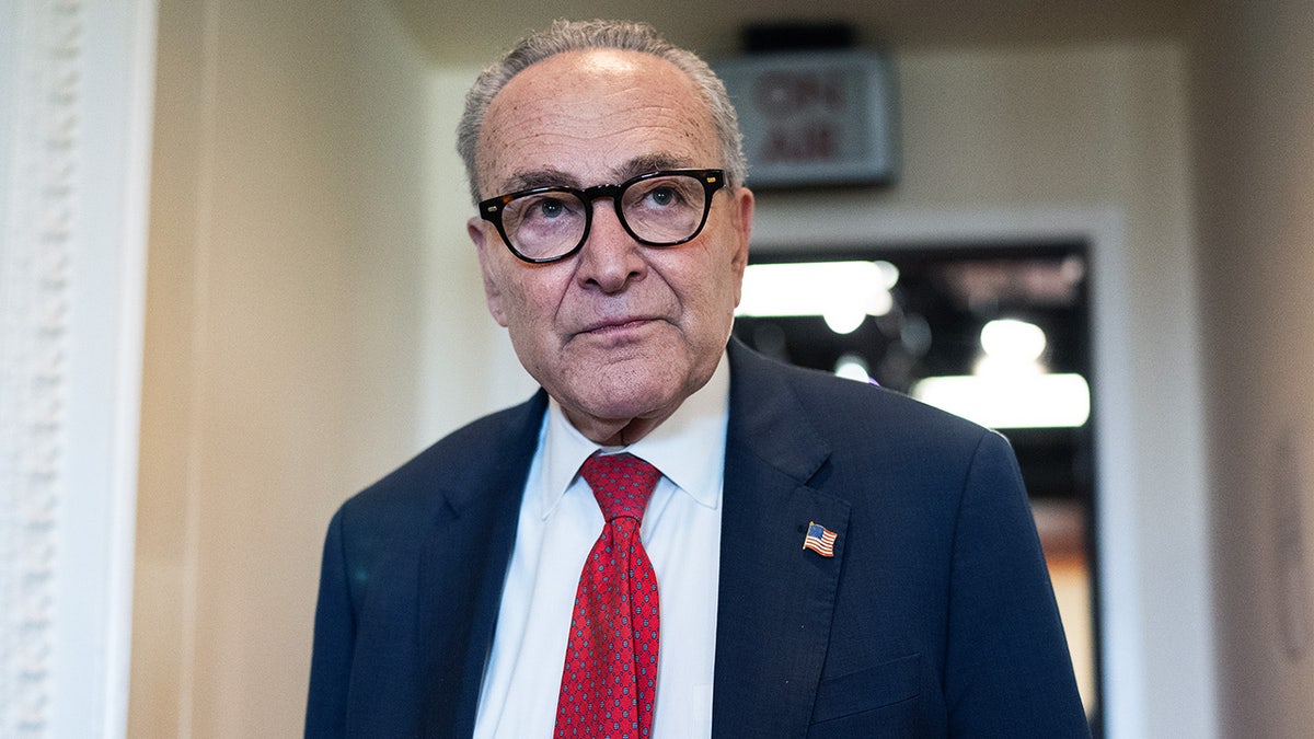 Chuck Schumer leaves a press briefing on Capitol Hill