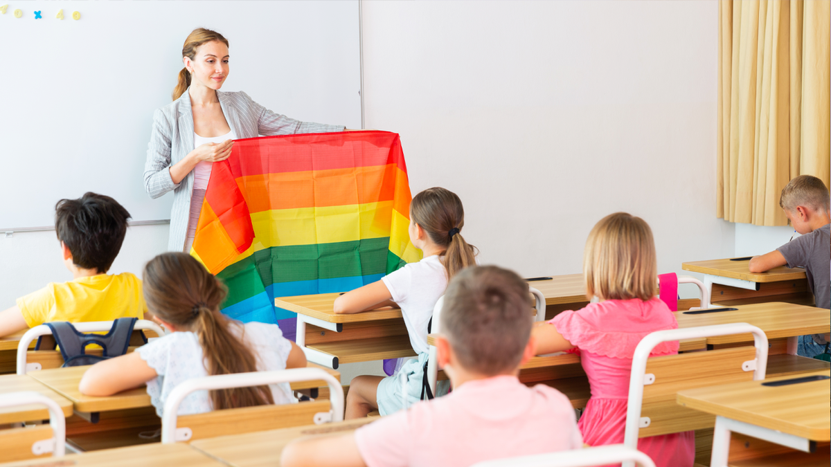 Teacher shows rainbow flag