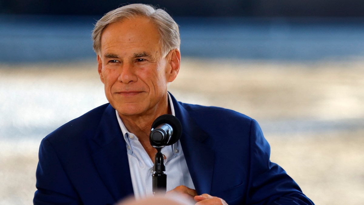 Texas Gov. Greg Abbott in front of microphone