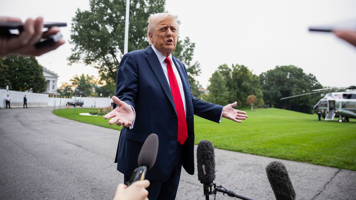 President Donald Trump speaks to members of the media on the South Lawn of the White House