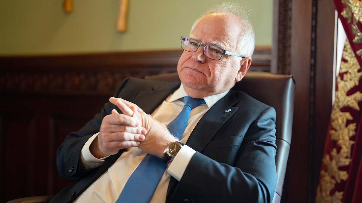 Minnesota governor speaks with local reporters during an in-office media interview.