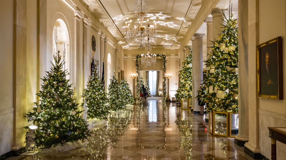 Christmas decorations are seen in the entrance and cross hall of the White House as part of first lady Jill Biden's "We the People" decorative theme in 2022.