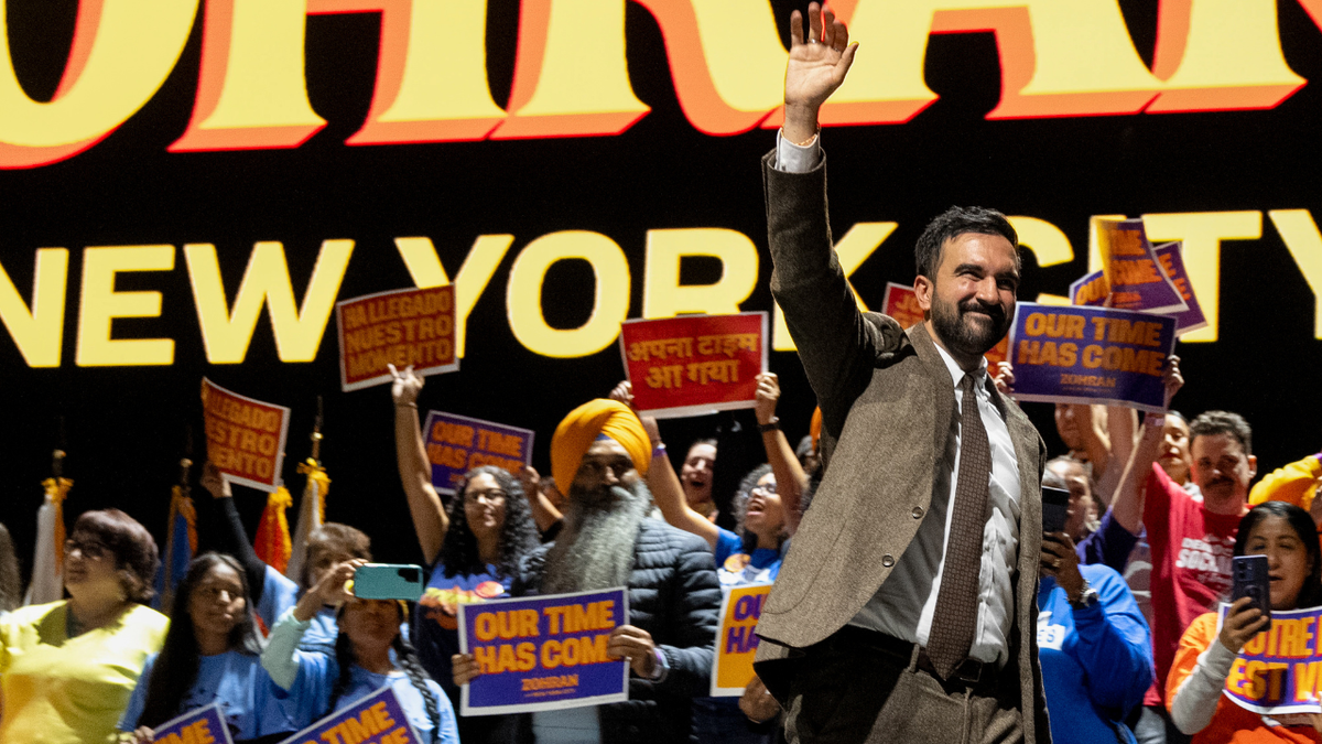 New York City mayoral candidate Zohran Mamdani waves to those attending a campaign rally