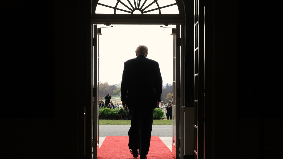 U.S. President Donald Trump walks out of the White House.