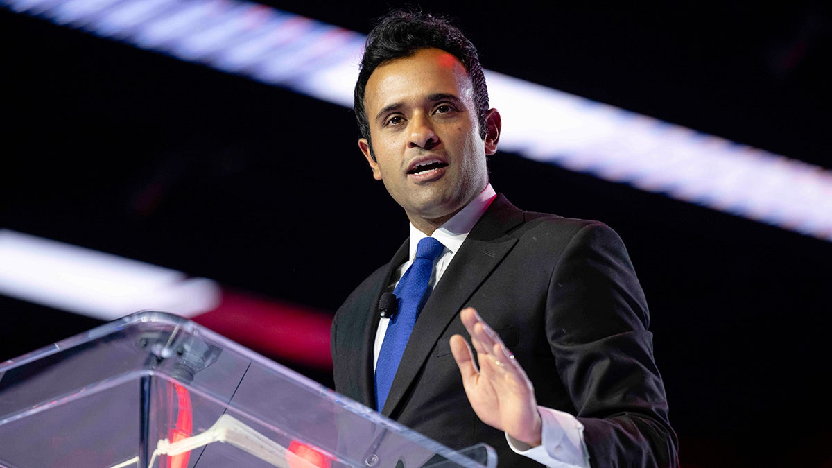 Vivek Ramaswamy speaks at podium during Turning Point USA conference