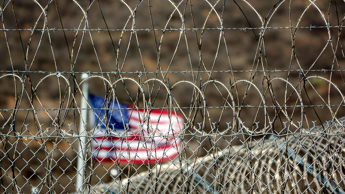 barbed wire surrounding the CoreCivic Otay Mesa Detention Center