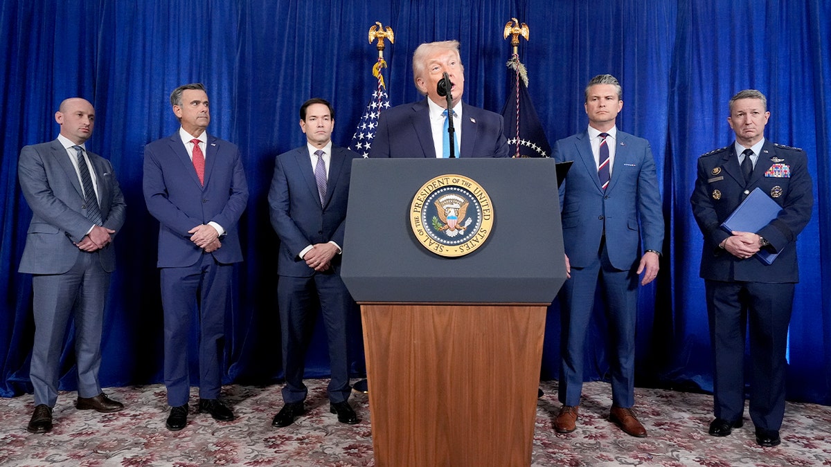 Trump delivers remarks from a lectern inside Mar-a-Lago.
