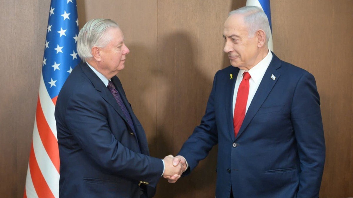 Sen. Lindsey Graham shakes hands with Israeli Prime Minister Benjamin Netanyahu
