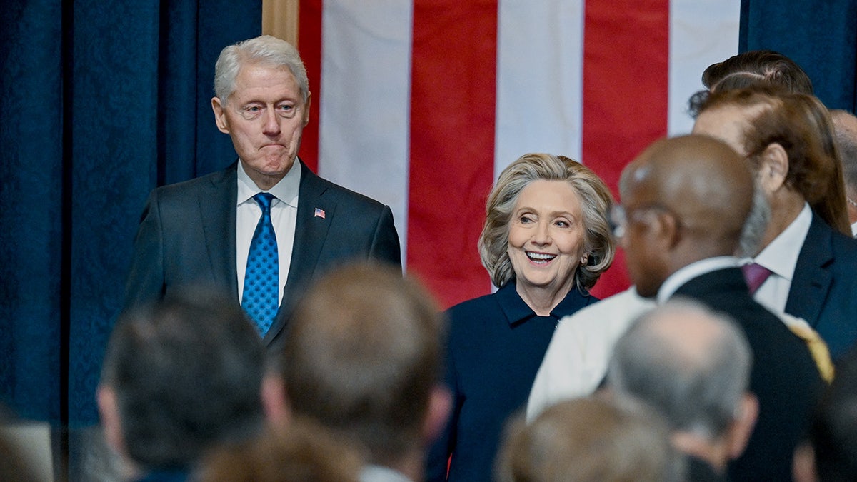 Bill Clinton, left, pictured with Hillary Clinton, right