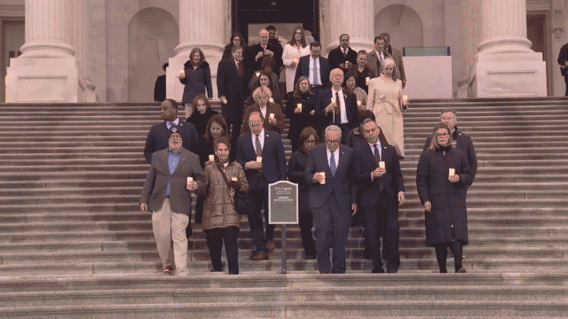 Congressional Democrats walk on the steps of Capitol Hill for Jan. 6 vigil