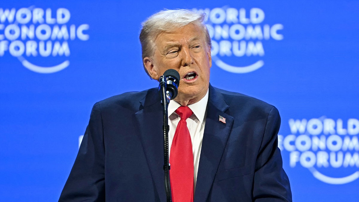 The U.S. president speaks from a podium before an audience of global leaders.
