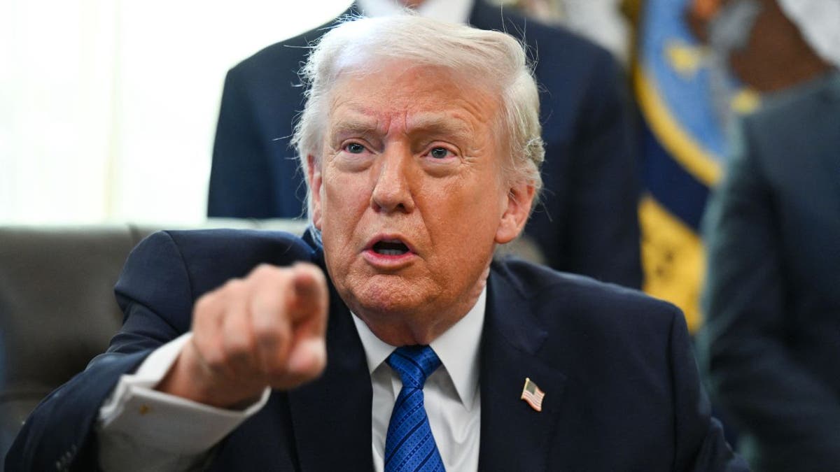 President Donald Trump speaks in the Oval Office at the White House.