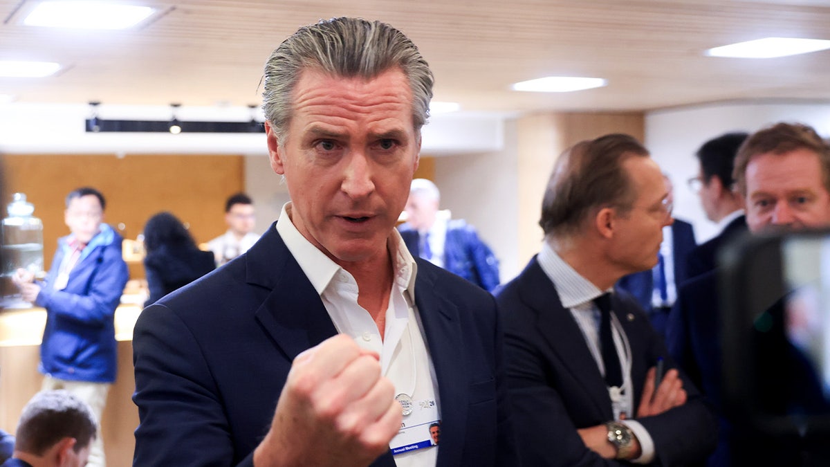 Newsom speaking to the media from Davos 