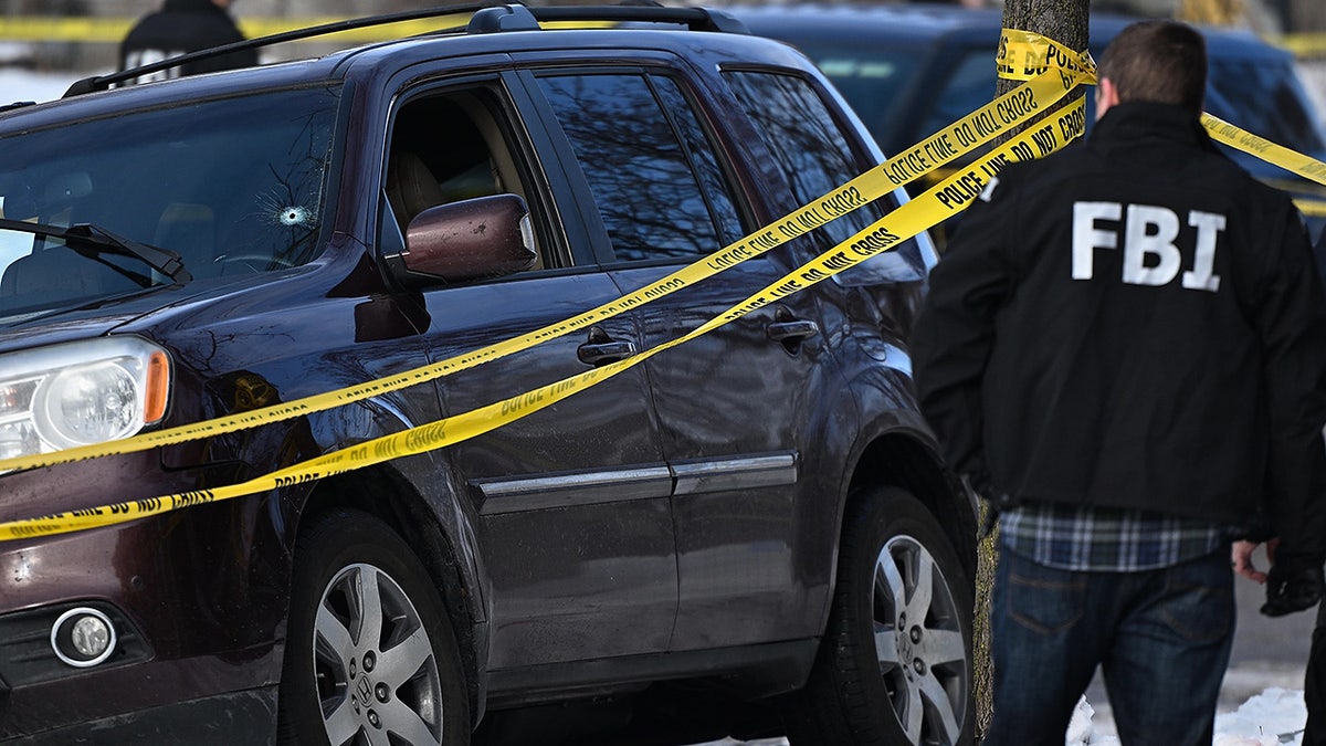 Law enforcement officers work the scene of a shooting involving federal law enforcement agents, Wednesday, Jan. 7, 2026, in Minneapolis. (AP Photo/Tom Baker)