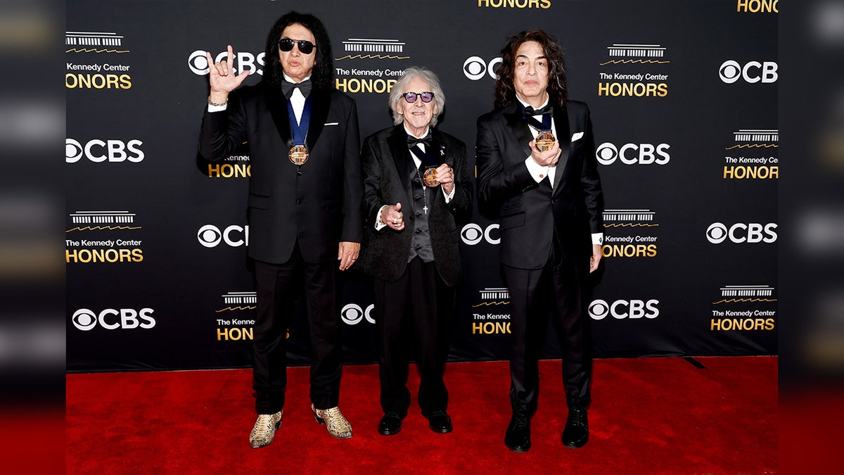 KISS band members walk red carpet