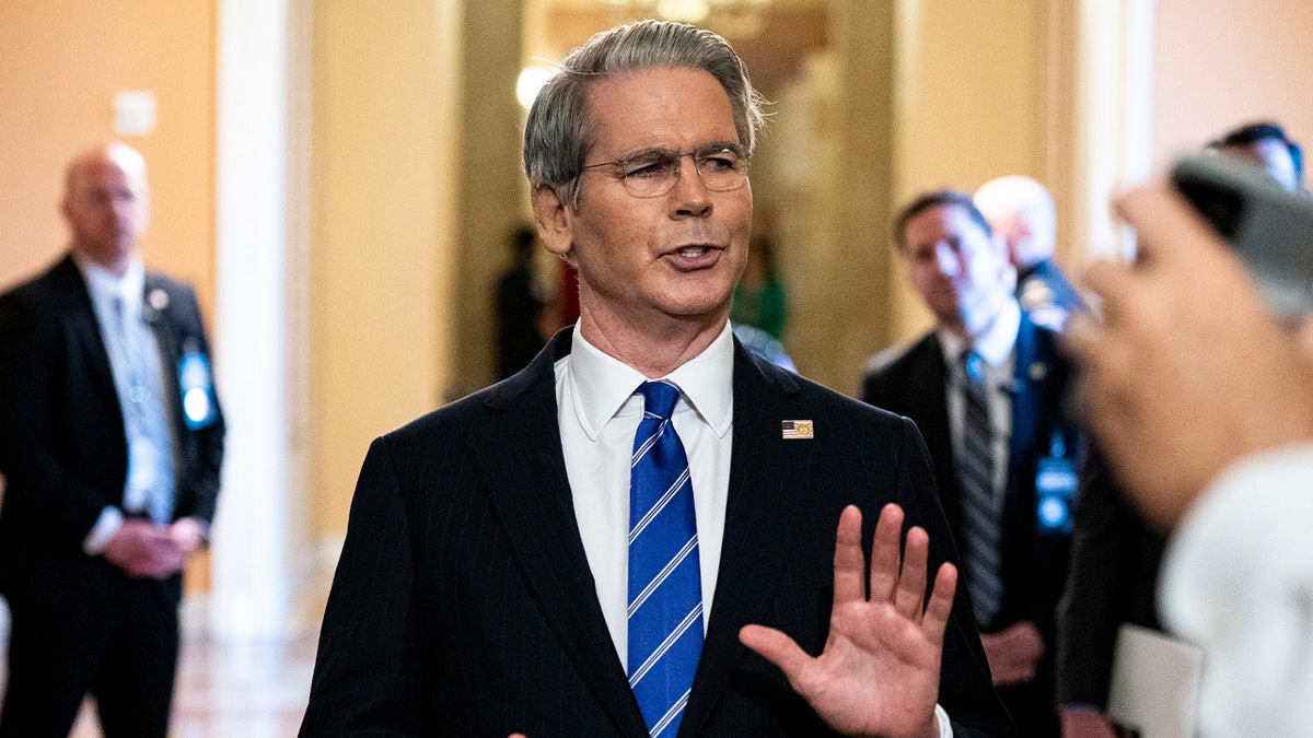 Scott Bessent speaks with reporters