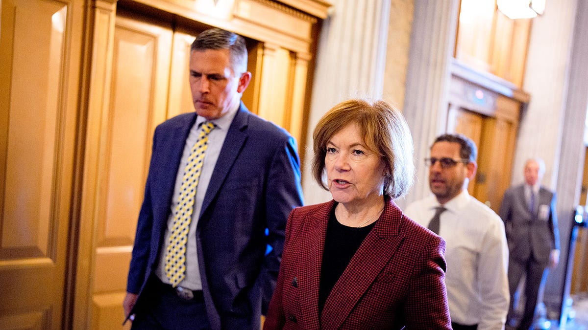 Sen. Tina Smith, D-Minn., walks to the Senate floor.