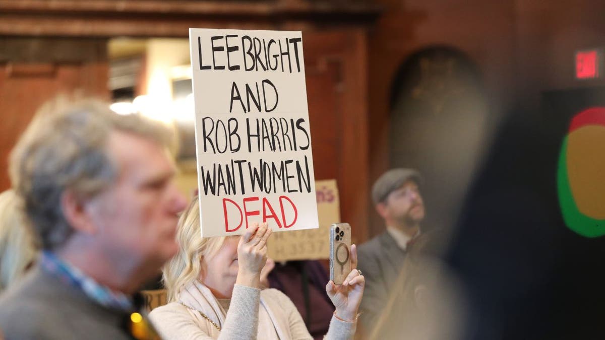A protester held a sign opposing an abortion bill at the South Carolina Statehouse in Columbia.