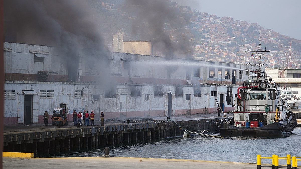 Smoke coming out of a building on a dock