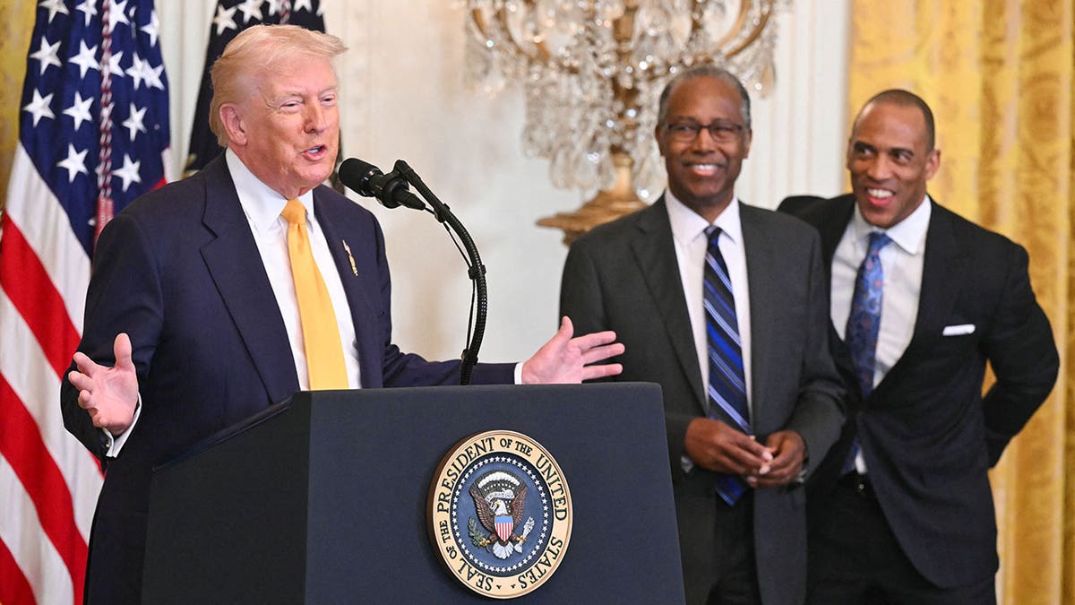 President Trump speaking with Ben Carson and Scott Turner