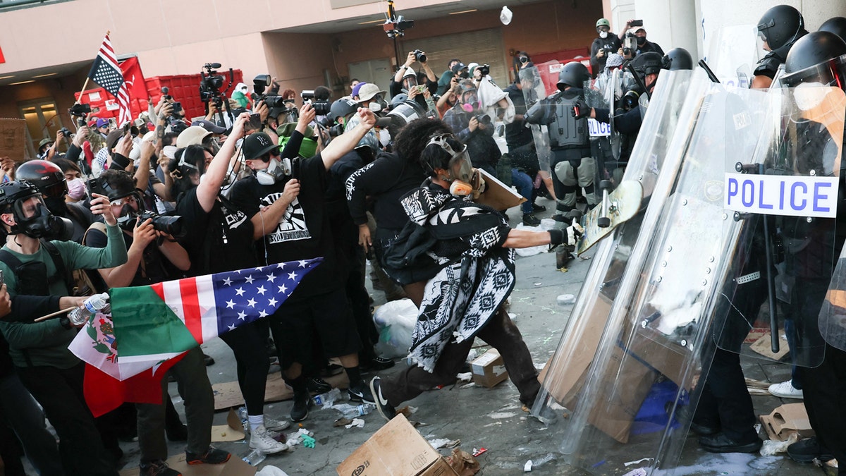 Anti-ICE protesters clash with police